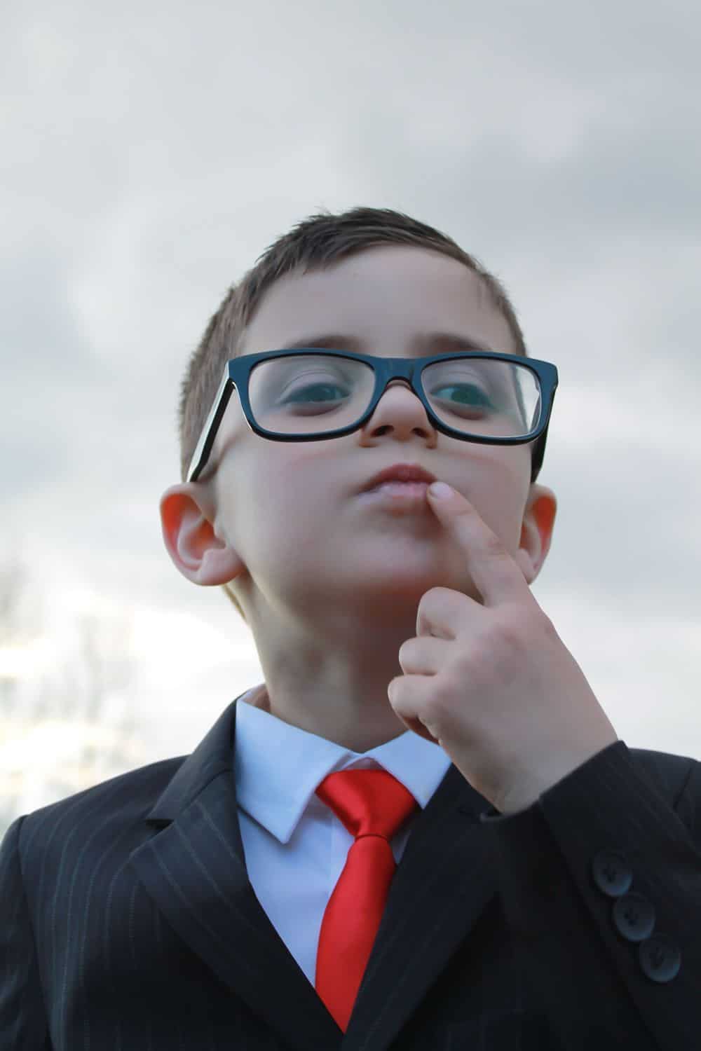 young genius child in smart suit