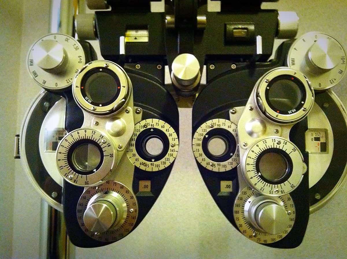 Image of a phoropter, the tool optometrists use to measure visual acuity. One of the goals of accessible mobile UI design is to make your apps more usable for those with vision challenges.