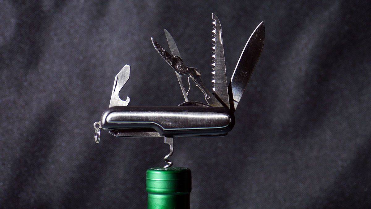 A multi-purpose tool set including corkscrew, knife, scissors, and bottle opener, just like tools for developers that aim to simplify every part of a development process.