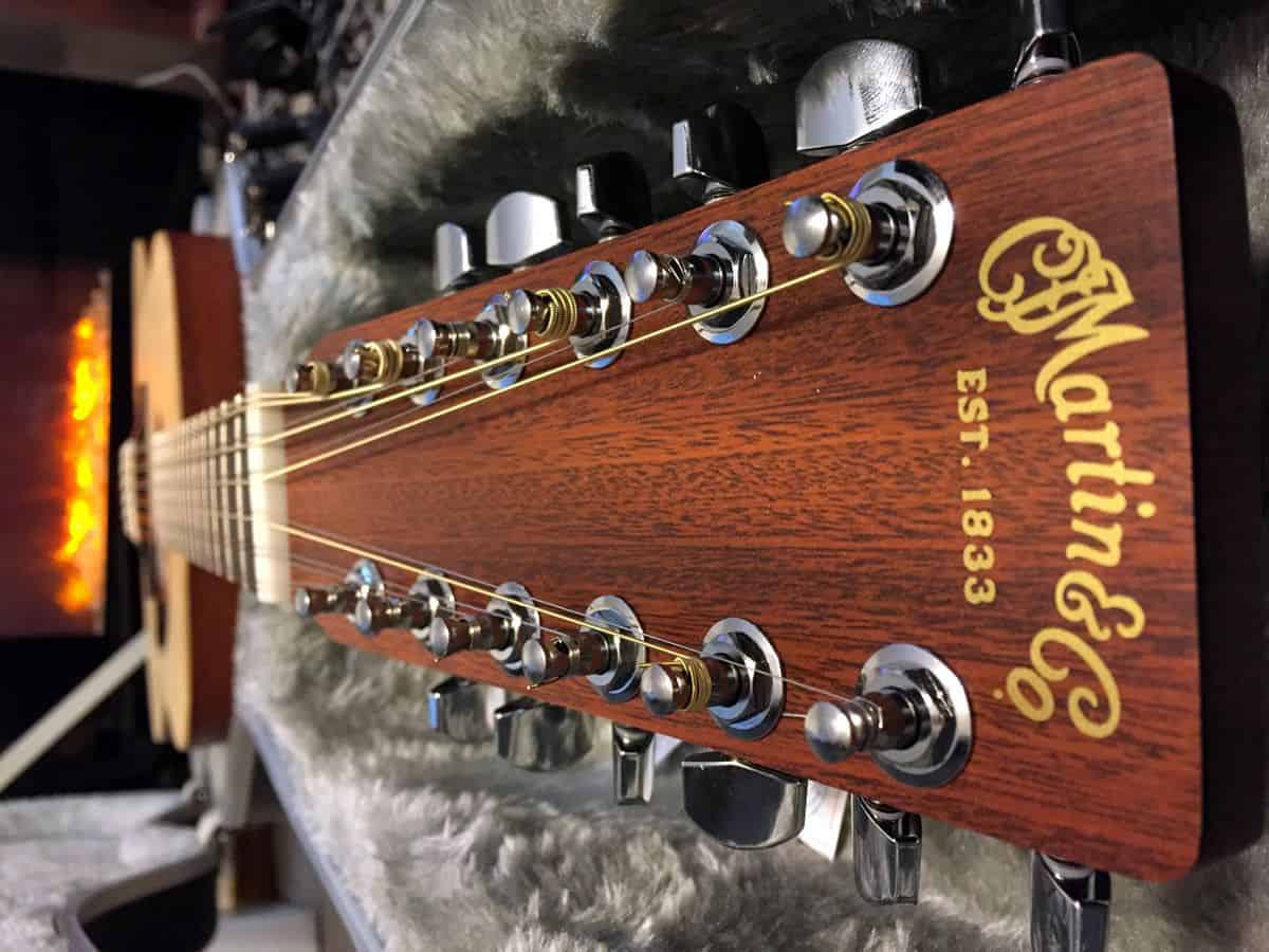 A view down the neck of a 12-string Martin acoustic guitar.