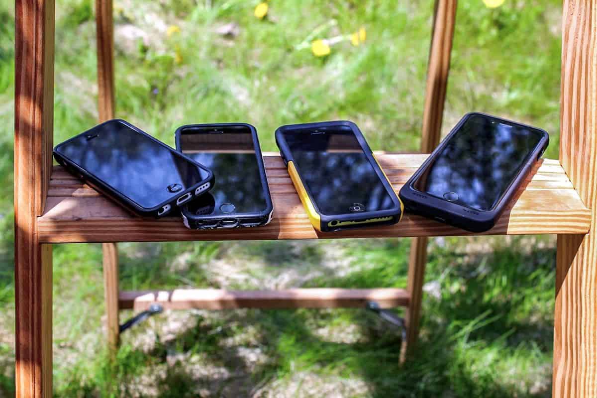 Multiple versions of the iPhone sit on a rung of a ladder on a sunny day. When learning how to design apps online, get a free tool that can help you see what the app looks like on the actual device, so you don’t have to collect every device in existence.