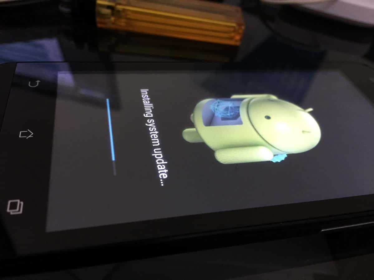 A close-up of an Android smartphone installing a system update.