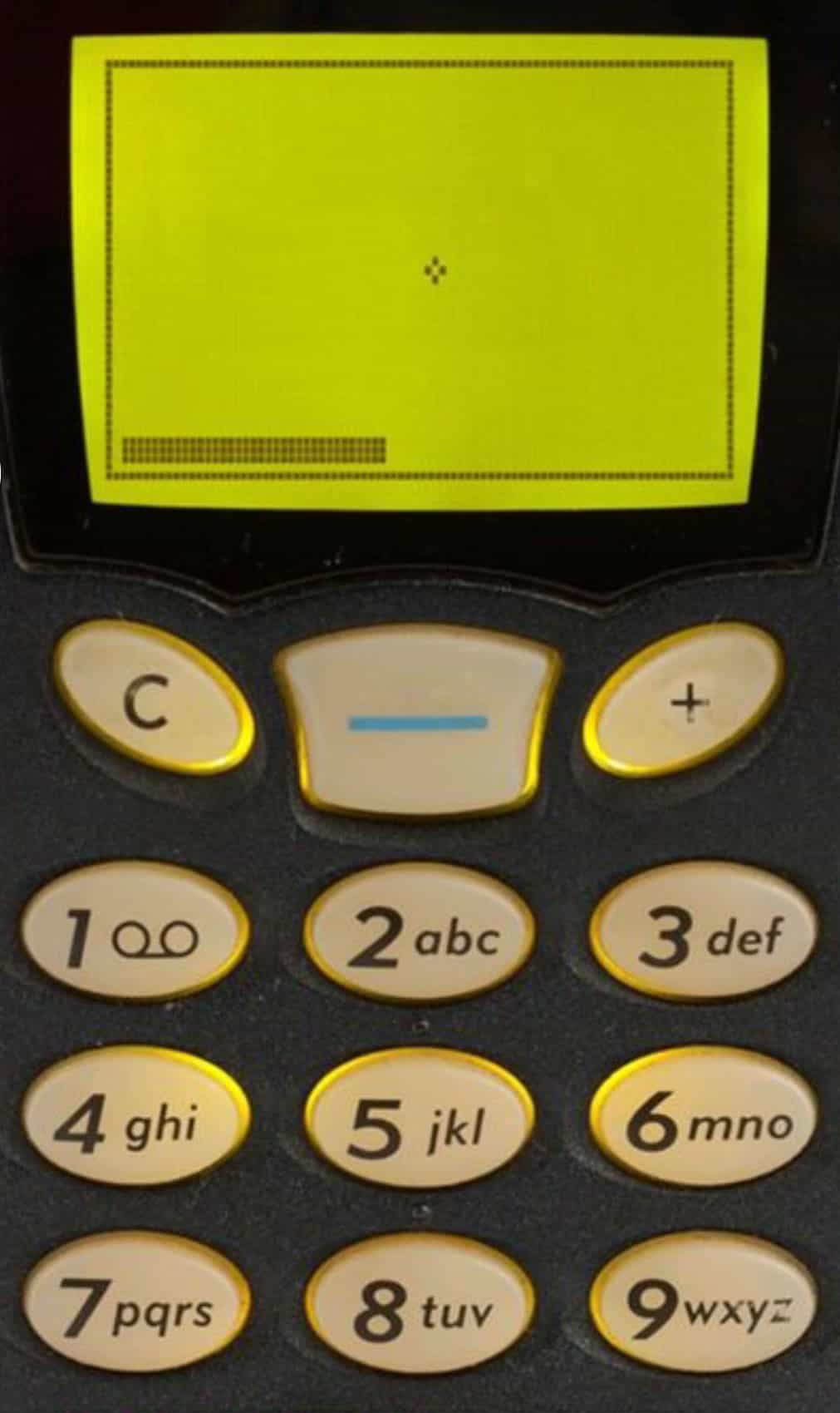 A photo of the game “Snake” on a monochromatic cell phone screen.