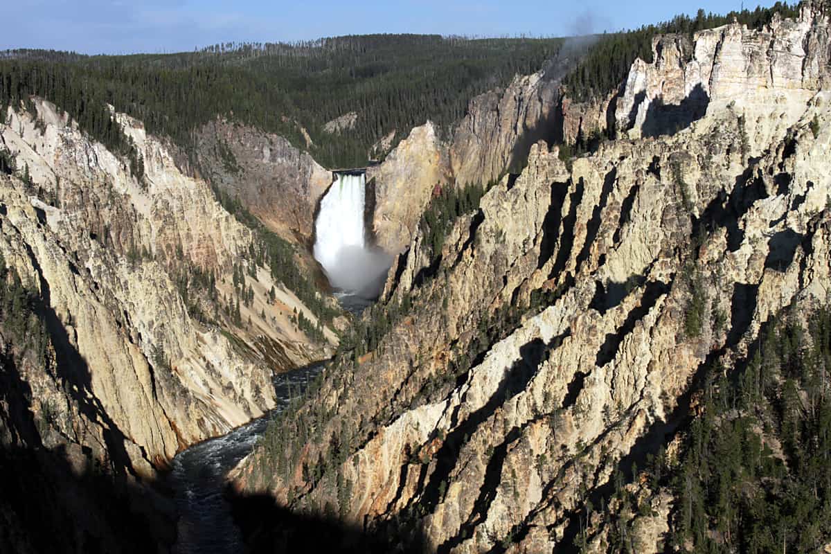 A photo of a large waterfall in the Lower Falls in Yellowstone National Park.