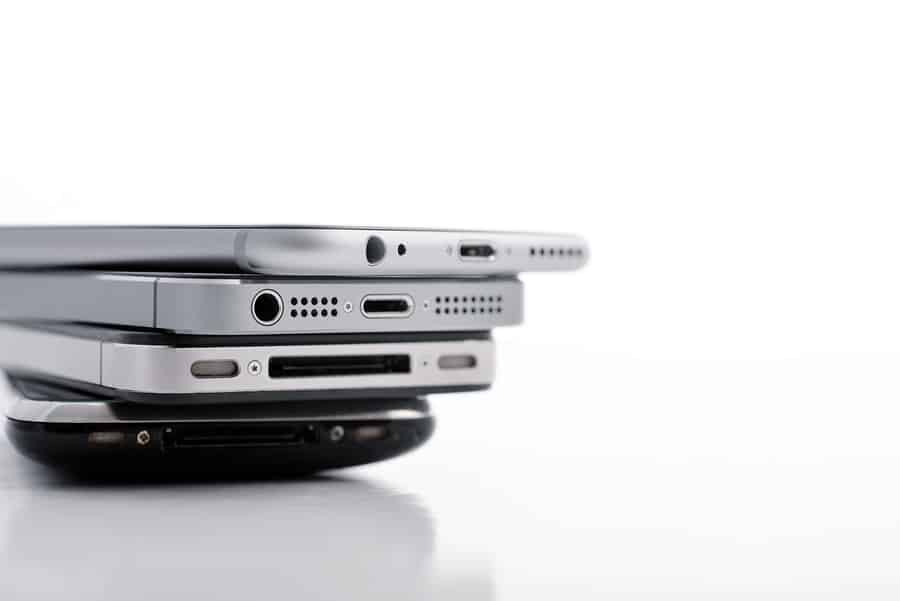 A photo of an iPhone 3GS, 4S, 5S, and 6 stacked on top of each other.