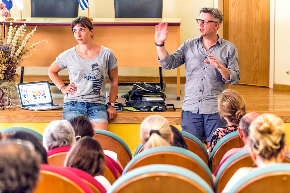 A photo of two people giving a lecture at a conference for mobile app designers.