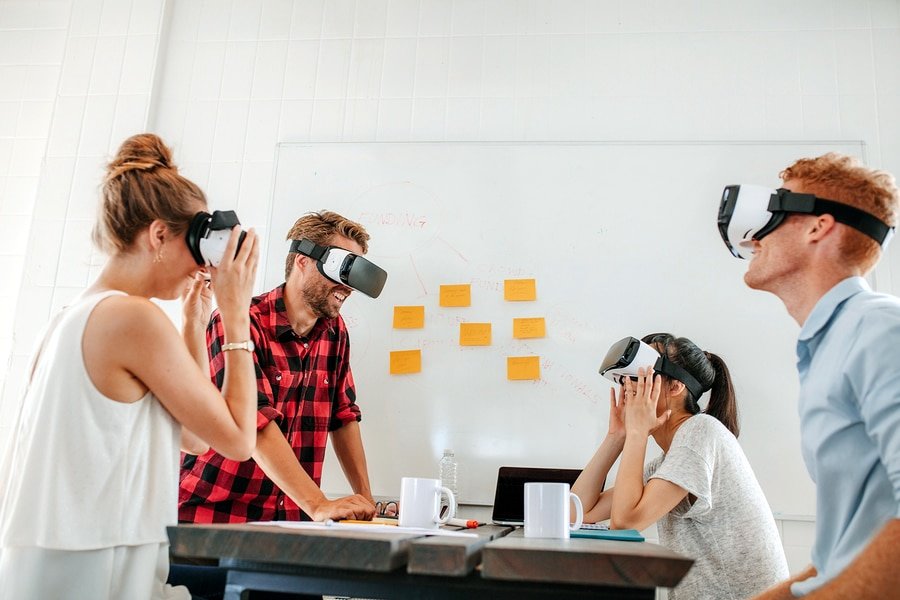 A photo of a work group finding new uses for virtual reality in their office.