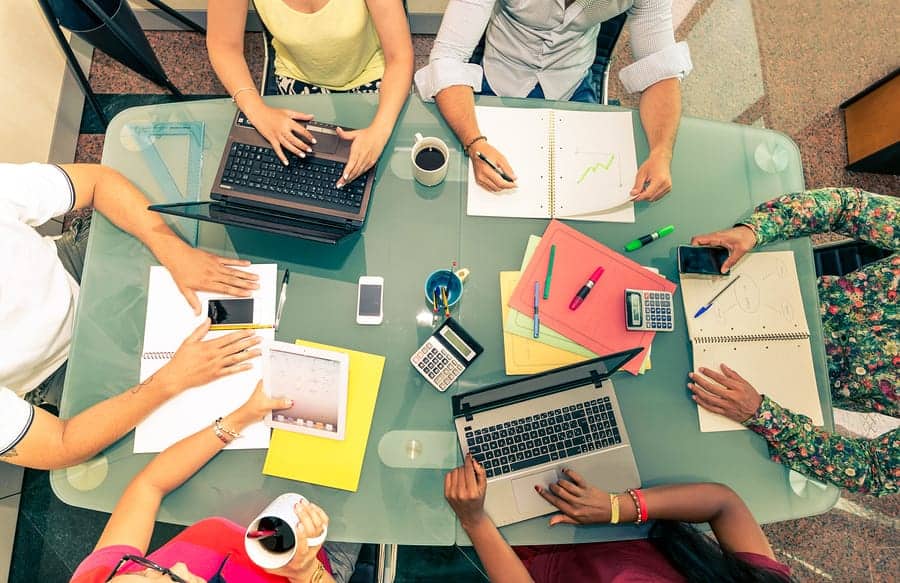 A photo of a work group preparing for a pitch meeting.