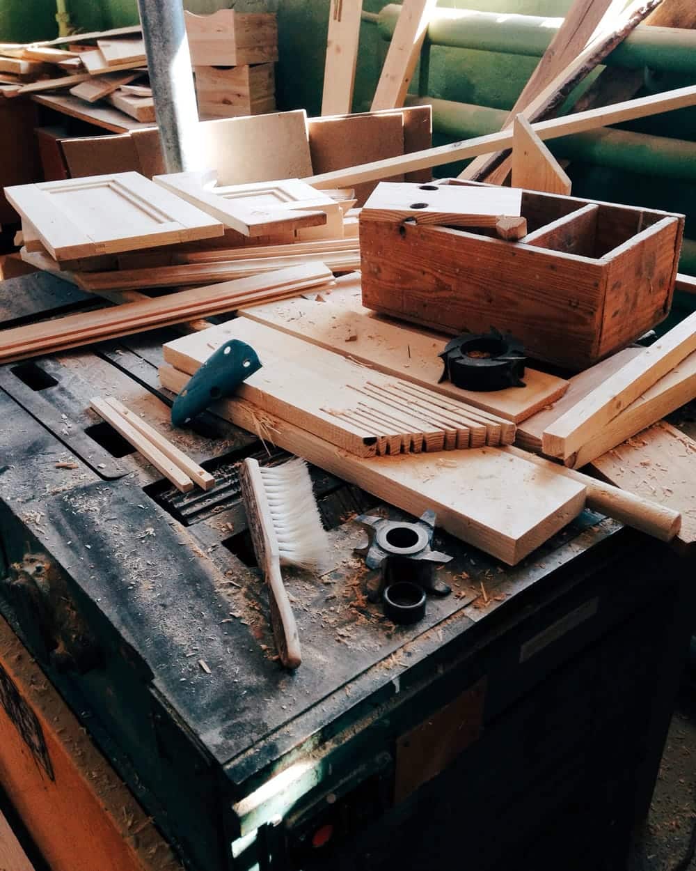 A woodworker tries to figure out a solution to a problem.