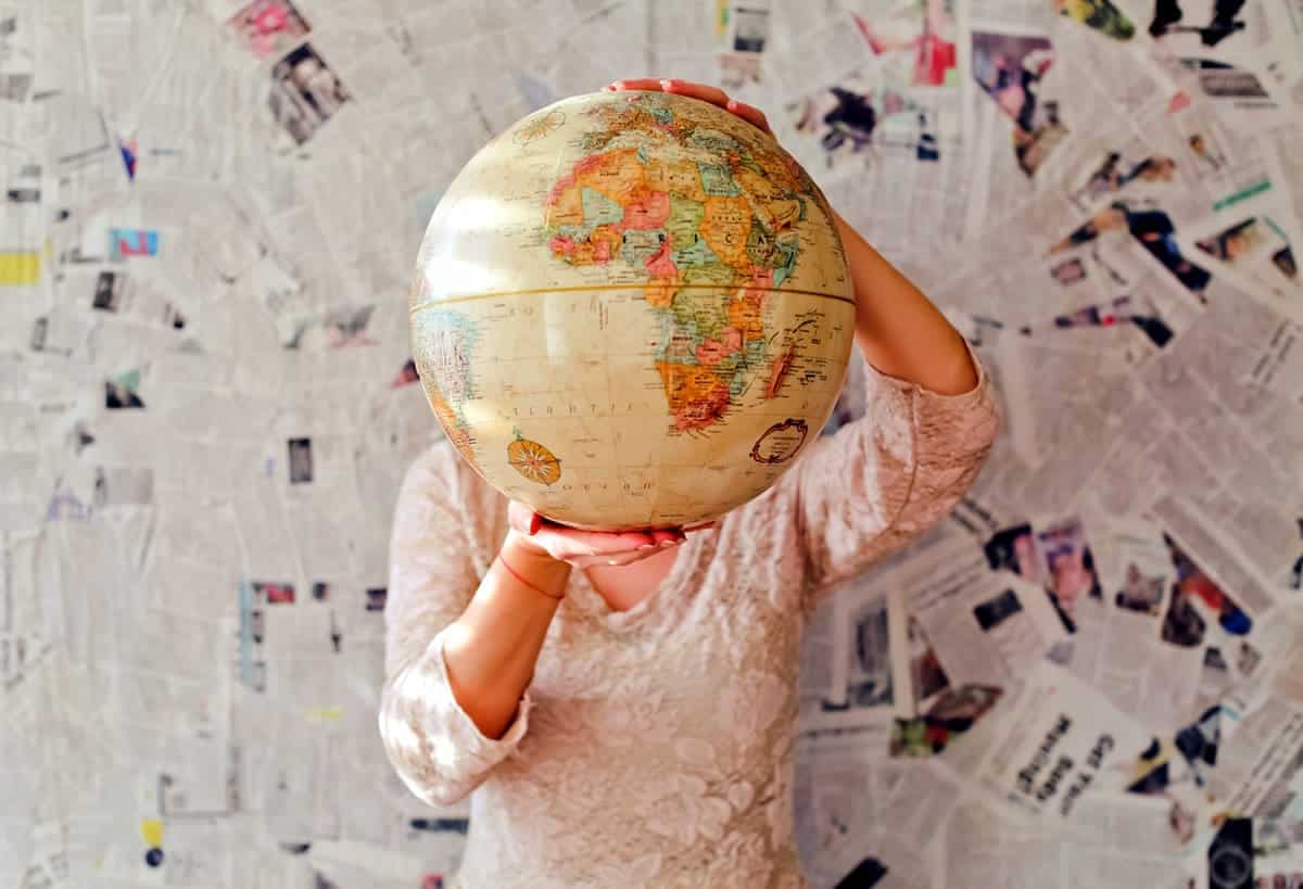 Image of a woman holding a globe