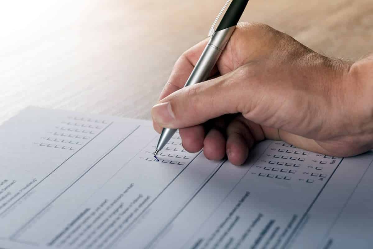 A photo of a person taking a test in class.