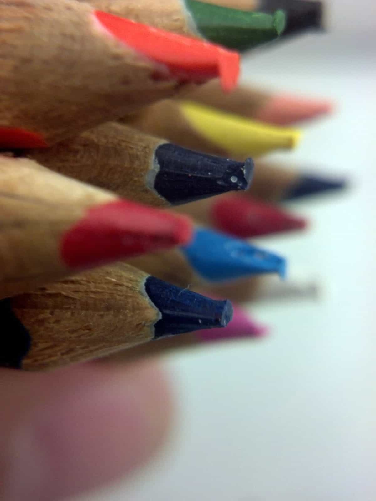 A close-up photo of sharpened colored pencils.