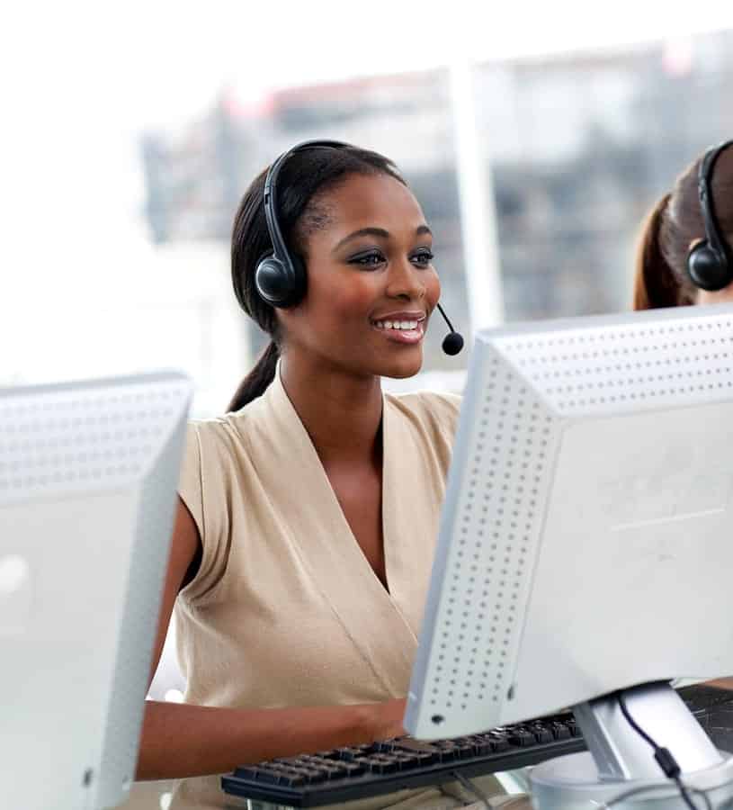 A photo of a customer service representative speaking to a caller through a headset.