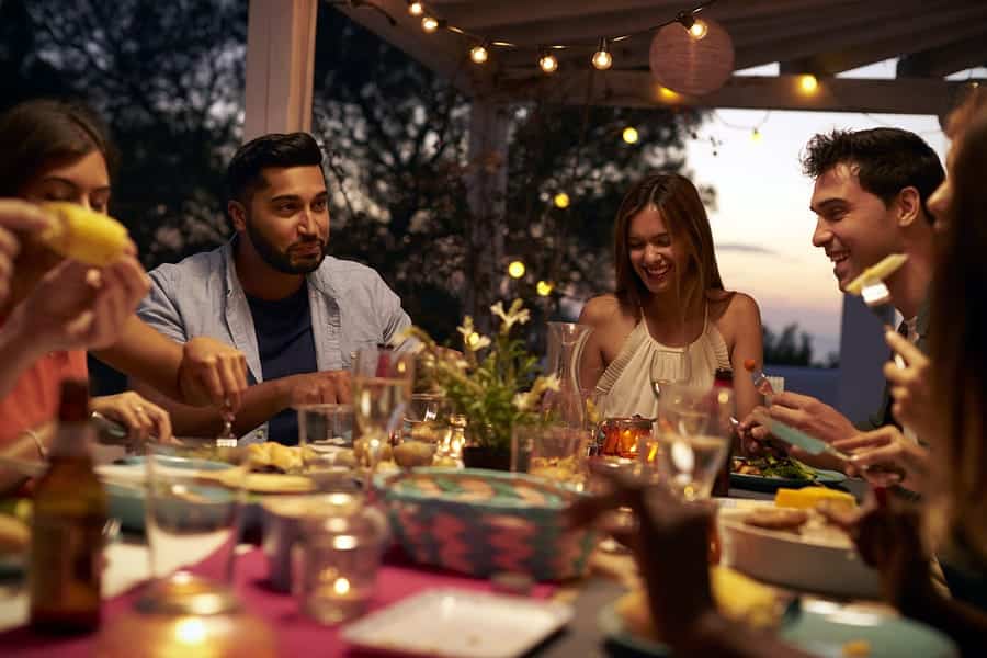 A photo of a group of friends gathered for a dinner party.