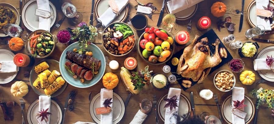 A photo of a Thanksgiving dinner table set and ready for guests.