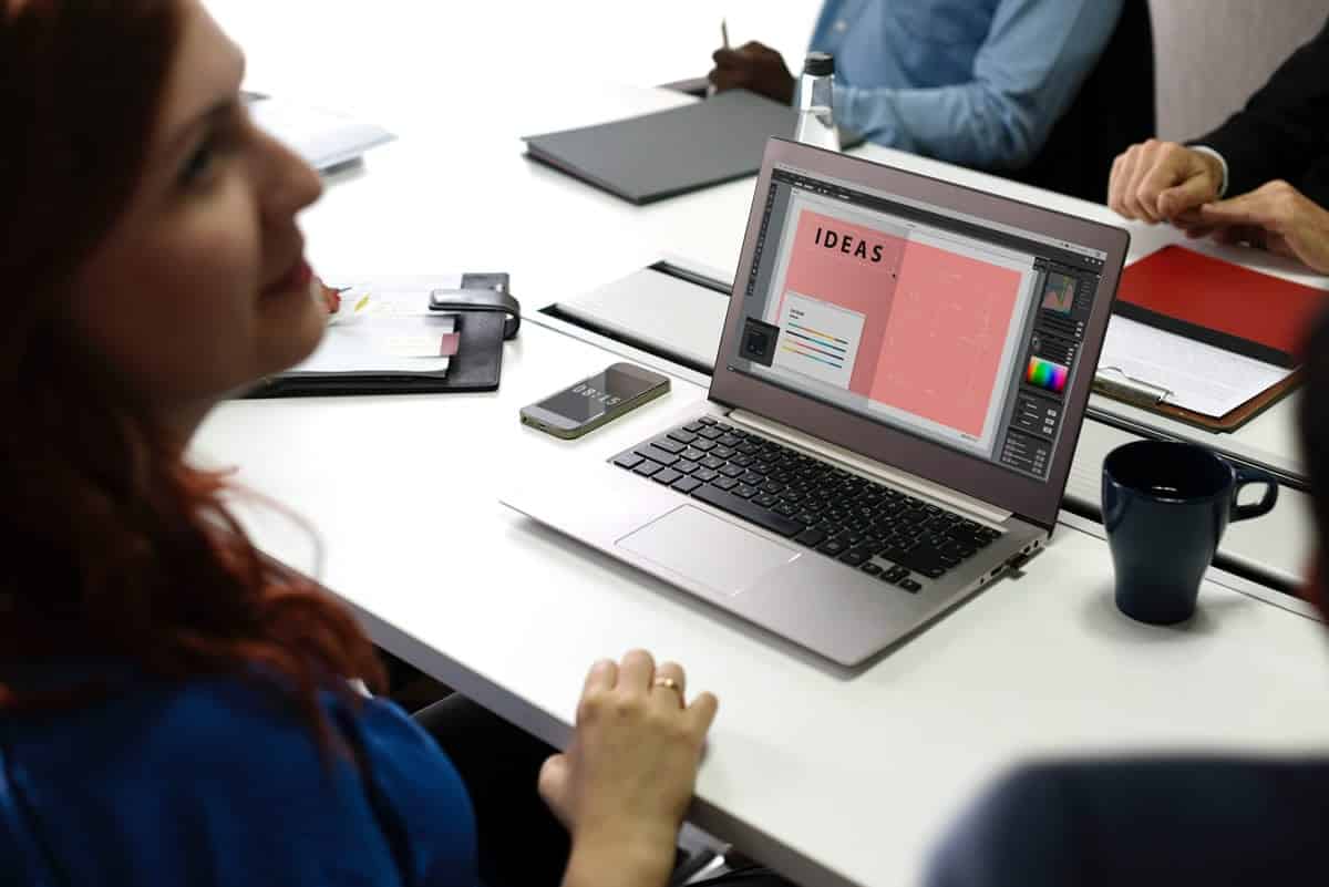 An image of a woman working on a sketch over a lightbox.