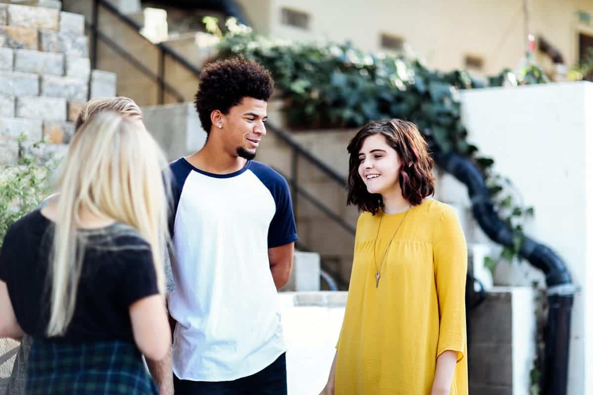 An image of three people discussing features during user testing.