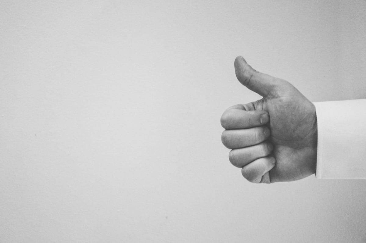 A person giving a thumbs up hand signal