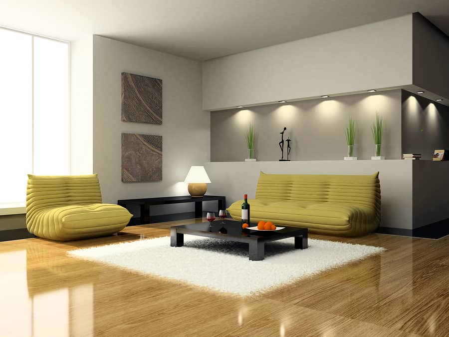 A rendering of what a living room may look like with two big mustard colored couches and modern tables.
