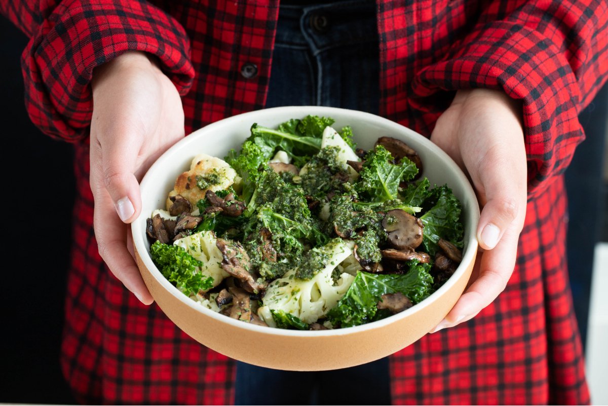 A photo of a broccoli, mushroom, and kale bowl from Fresh and Lean.