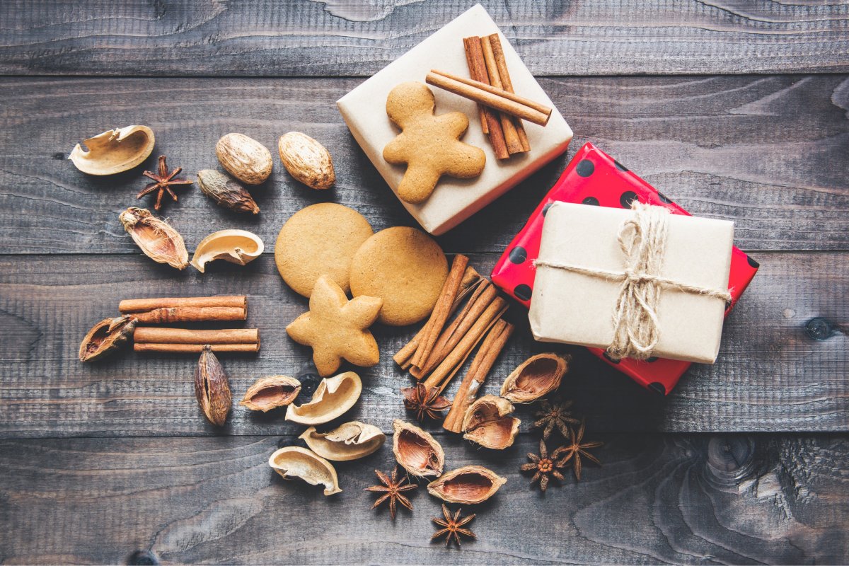 A photo of holiday treat packages complete with gingerbread cookies, nuts, and cinnamon sticks.