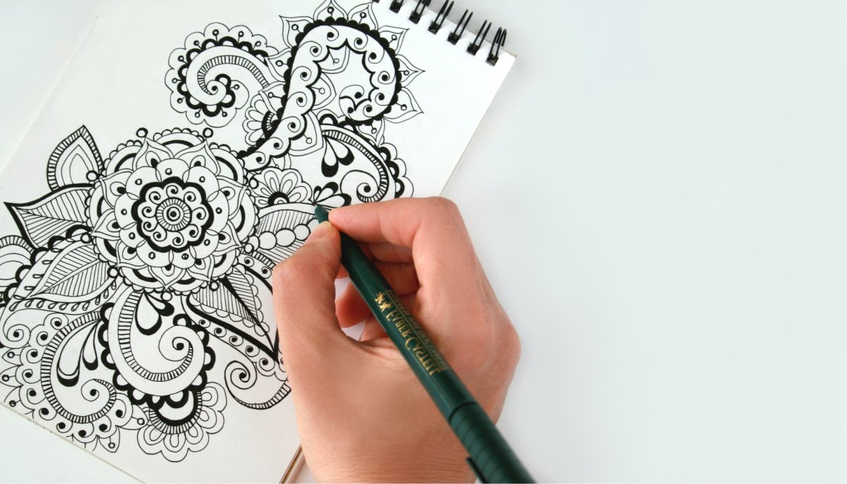  A person working on an intricate drawing.