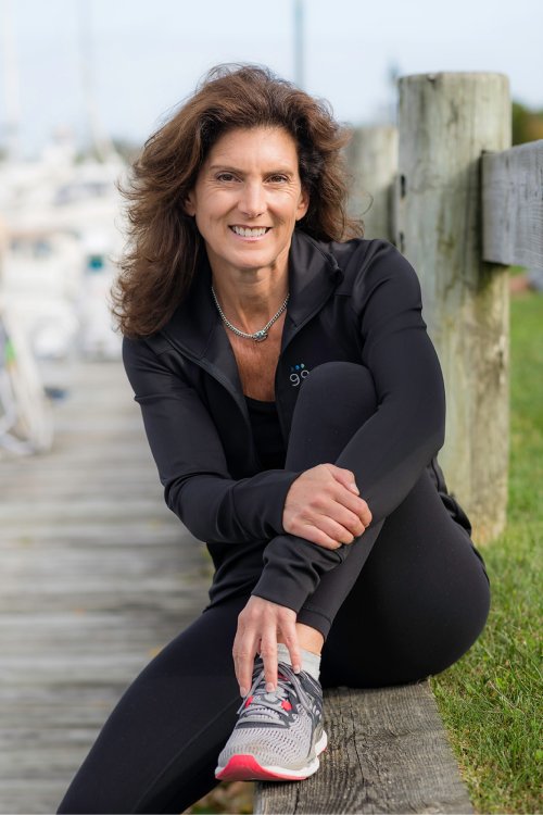 A photo of Joyce Shulman wearing workout clothes and walking shoes.