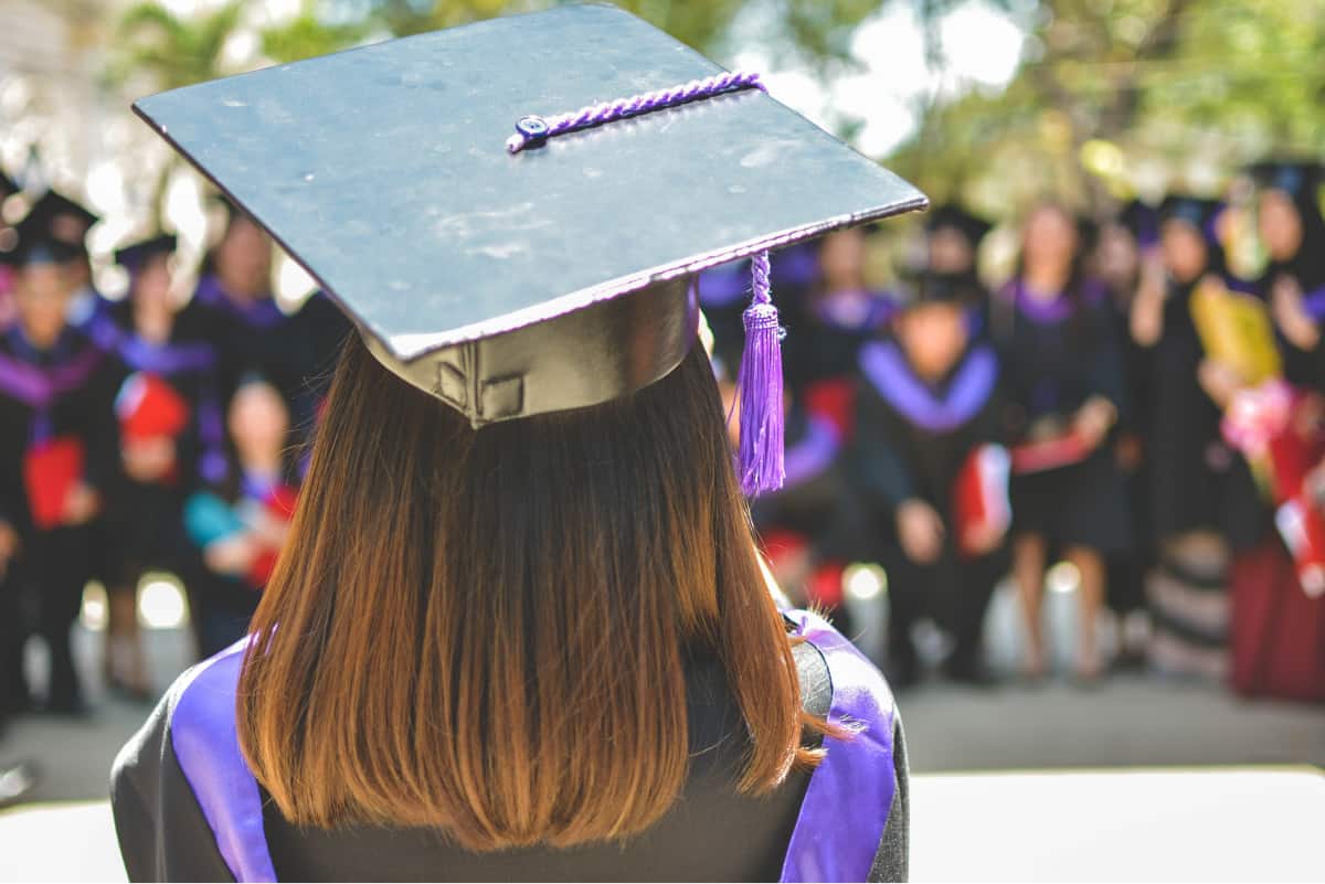 College graduate facing away from the camera.