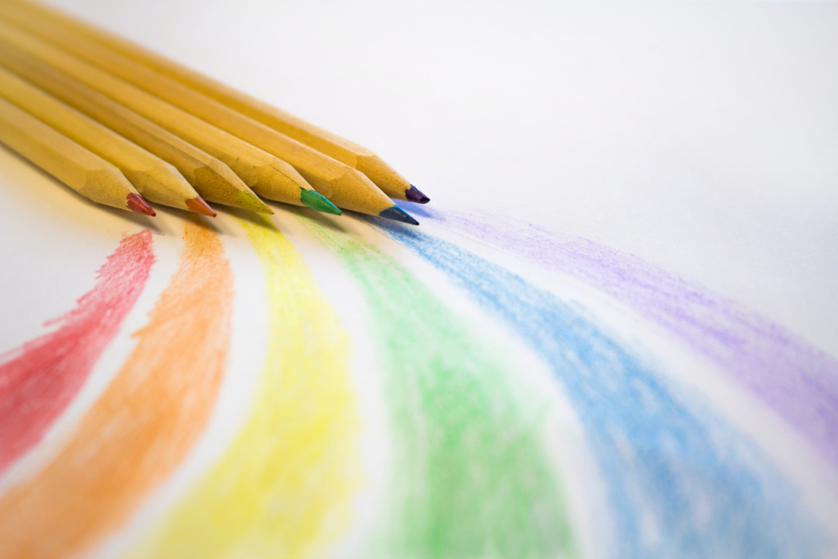  A rainbow on paper drawn with colored pencils. 