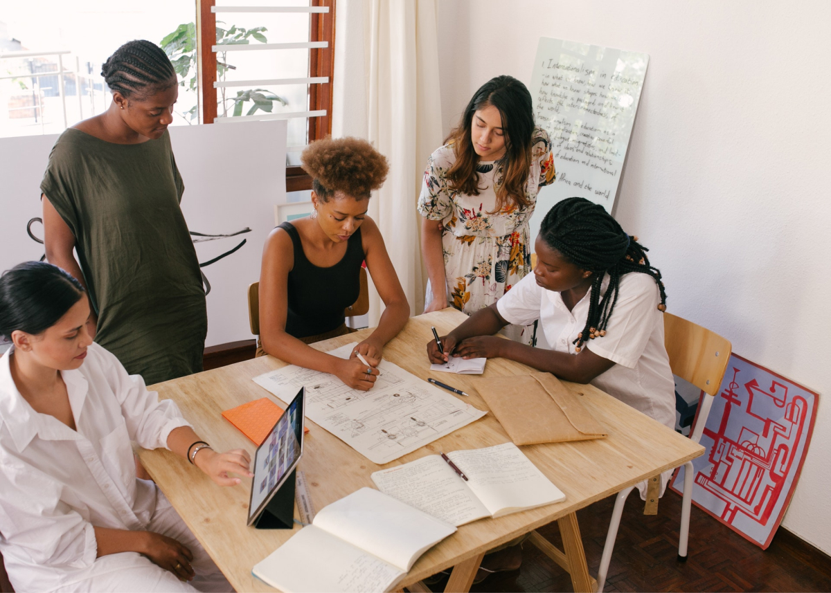 Women meeting to discuss app feedback.