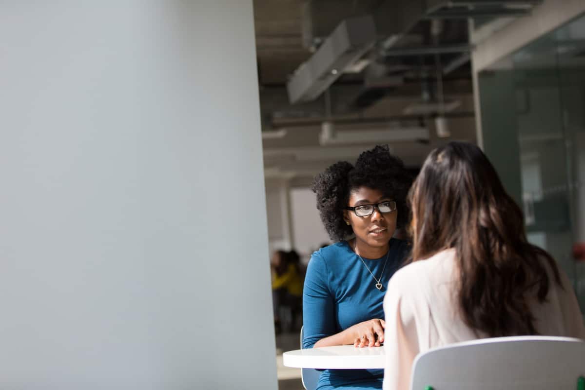 Two women in an interview in an office.