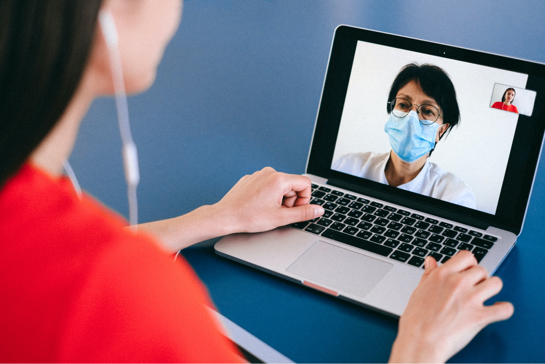 A woman on a video call with her doctor. 